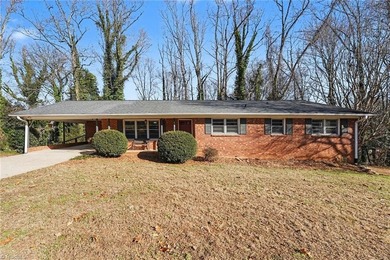 Classic 3 BR, 2 BA brick ranch offers charm, *character*, and