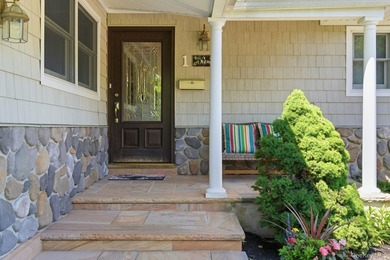 Welcome to this beautifully updated L-Shaped Ranch nestled in - photo 3