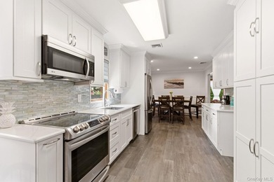 Welcome to this beautifully updated L-Shaped Ranch nestled in - photo 9