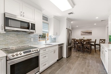 Welcome to this beautifully updated L-Shaped Ranch nestled in - photo 10
