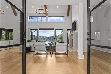 MODERN CALIFORNIA-INSPIRED LAKEFRONT RETREAT WITH POOL | Built