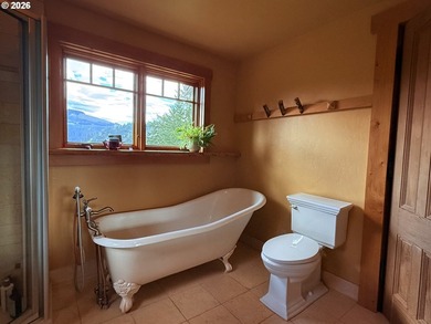 Perched on 42 pristine acres overlooking the Rogue River, this - photo 19