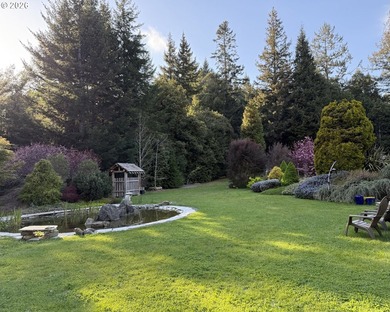 Perched on 42 pristine acres overlooking the Rogue River, this - photo 34