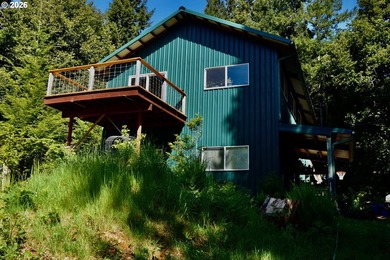 Perched on 42 pristine acres overlooking the Rogue River, this - photo 40