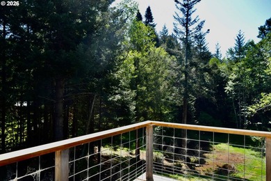 Perched on 42 pristine acres overlooking the Rogue River, this - photo 43
