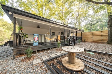 Nestled on a beautiful creek bank with water access to the - photo 30