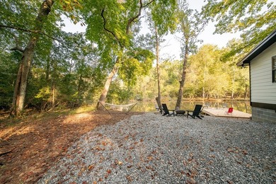 Nestled on a beautiful creek bank with water access to the - photo 32