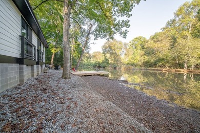 Nestled on a beautiful creek bank with water access to the - photo 36