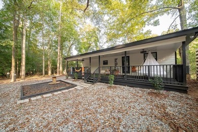 Nestled on a beautiful creek bank with water access to the - photo 40