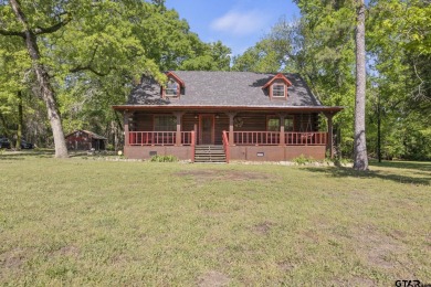Charming 3 bed, 2 bath log house nestled on half an acre of - Lake Home For Sale in Scroggins, Texas