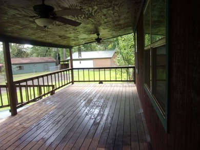Attractive, log type home sitting on three lots, fenced,  with