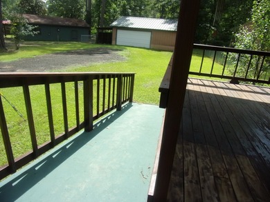 Attractive, log type home sitting on three lots, fenced,  with