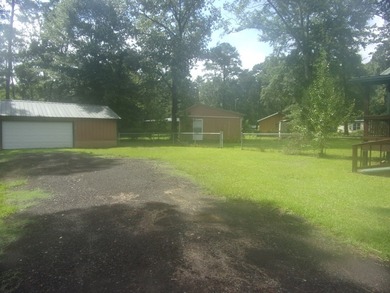 Attractive, log type home sitting on three lots, fenced,  with