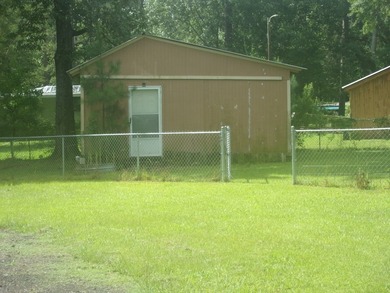 Attractive, log type home sitting on three lots, fenced,  with