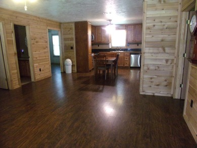 Attractive, log type home sitting on three lots, fenced,  with