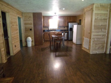 Attractive, log type home sitting on three lots, fenced,  with