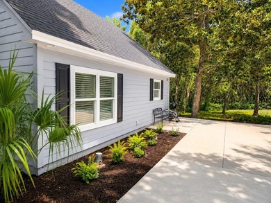 Tucked away on a large, private lot surrounded by beautiful - photo 1