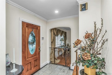 Set on a manicured corner lot in Bayside, this expanded Colonial - photo 3