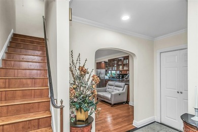 Set on a manicured corner lot in Bayside, this expanded Colonial - photo 4