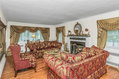 Set on a manicured corner lot in Bayside, this expanded Colonial - photo 5