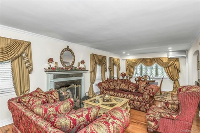 Set on a manicured corner lot in Bayside, this expanded Colonial - photo 6