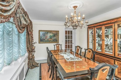 Set on a manicured corner lot in Bayside, this expanded Colonial - photo 8