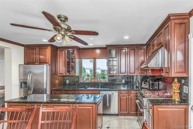 Set on a manicured corner lot in Bayside, this expanded Colonial - photo 10