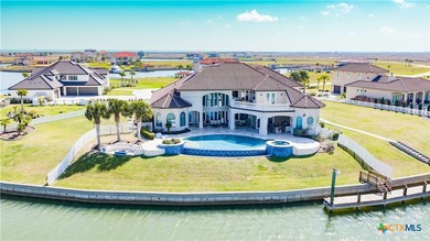 Located on the tranquil shores of the gated community of The - photo 4
