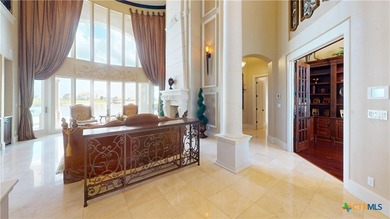 Located on the tranquil shores of the gated community of The - photo 7