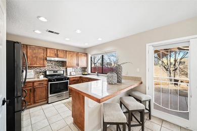 Set within a peaceful gated community, this Santa Fe home blends