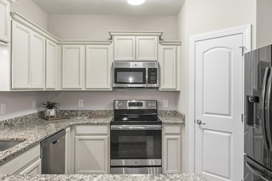 This well-maintained condo in Queens Harbor offers comfort