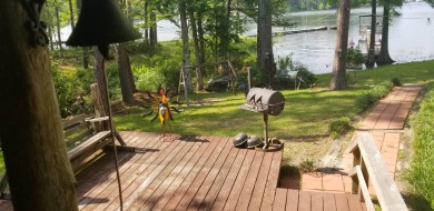 Cute rustic cabin on the lake!  Come sit on the back porch and - Lake Home Sale Pending in Burkeville, Texas