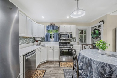 Welcome to this beautifully updated ranch offering the ease of - photo 9