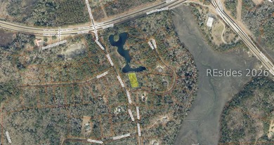 This 1.02 acre wooded lot has a rear lagoon view and is located - photo 2