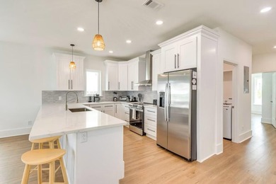 Discover coastal living just moments from the pristine shoreline - photo 6