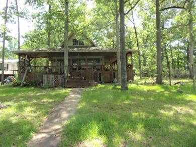 This Home needs TLC. Beautiful water front with pier. Boat Ramp - Lake Home Off Market in Hemphill, Texas