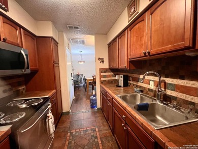 Prime Location & Security! This move-in ready condo is nestled