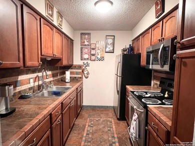 Prime Location & Security! This move-in ready condo is nestled