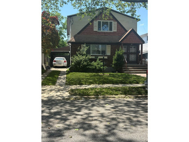 Spacious and well-located two-family home nestled in the heart - photo 1