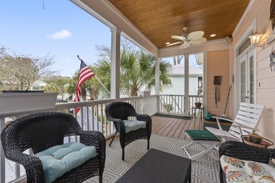 Four-bedroom, three-bathroom, elevated coastal home with a - photo 2