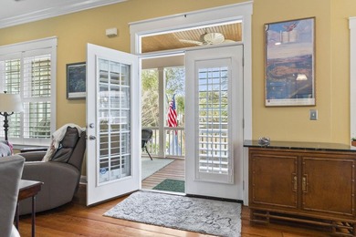 Four-bedroom, three-bathroom, elevated coastal home with a - photo 4