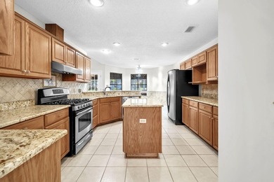 Rarely available in Niceville, this single-level pool and spa - photo 3