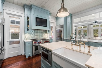 This stunning custom home in WaterColor is a masterful blend of - photo 11