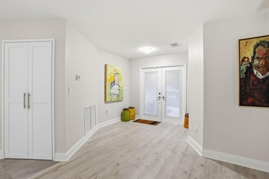 Tucked away within one of East West Palm Beach's most - photo 6