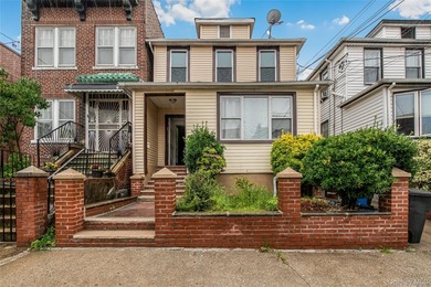 Welcome to this beautiful legal two-family home located in the - photo 1