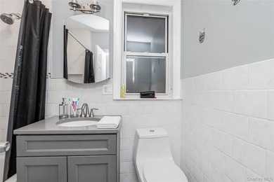 Welcome to this beautiful legal two-family home located in the - photo 3