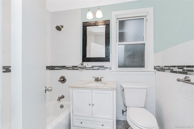 Welcome to this beautiful legal two-family home located in the - photo 4