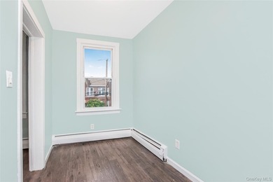 Welcome to this beautiful legal two-family home located in the - photo 7