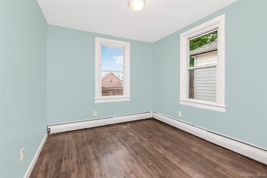 Welcome to this beautiful legal two-family home located in the - photo 9