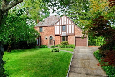 Storybook charm meets timeless elegance in this classic Tudor - photo 1